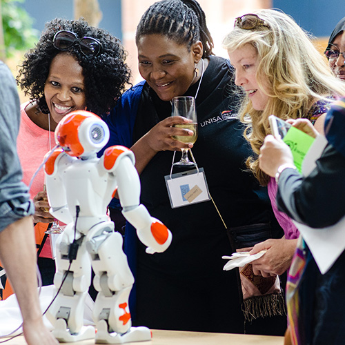 Women interact with robot